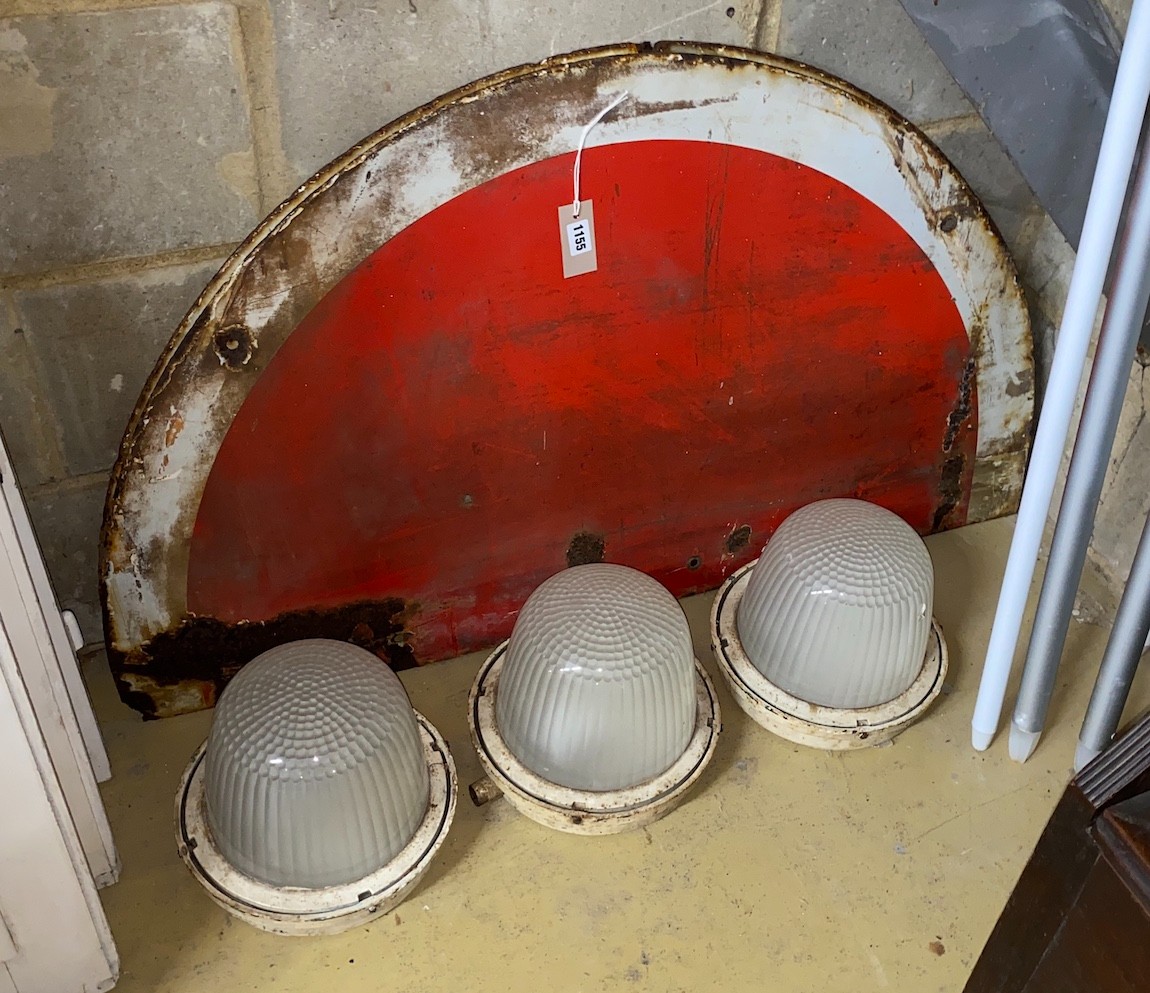 A vintage enamel circular railway stop sign in two sections, diameter 122cm together with three industrial style lights